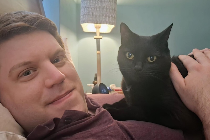 Image of Peter and Jack having a cuddle.